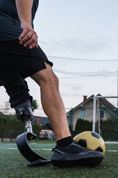 istock Man with prosthetic leg plays soccer 2254786733