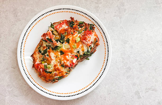 Eggs With Cheese And Spinach Cooked In An Air Fryer On Top Of Toasted Sourdough Bread