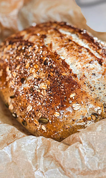 Homemade 12 grain bread that has been baked in a roast pan.