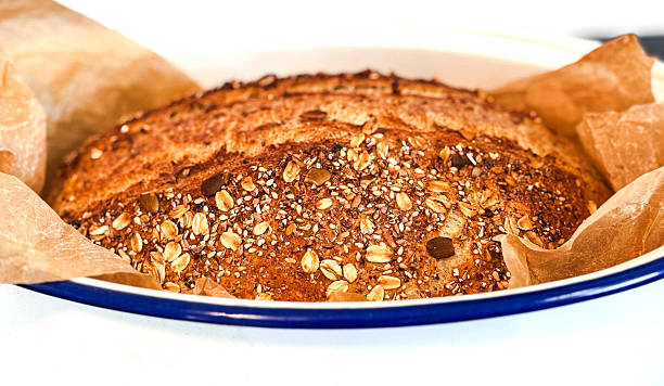 Homemade 12 grain bread that has been baked in a roast pan.