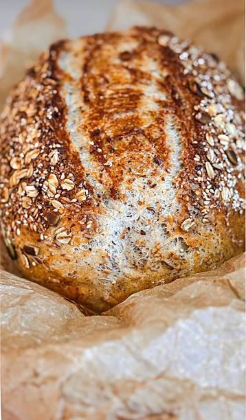 Homemade 12 grain bread that has been baked in a roast pan.