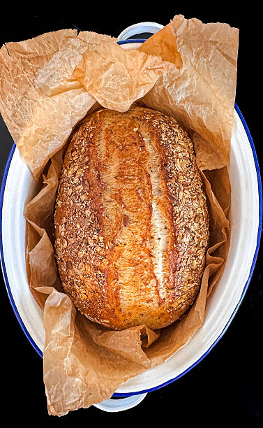 Homemade 12 grain bread that has been baked in a roast pan.