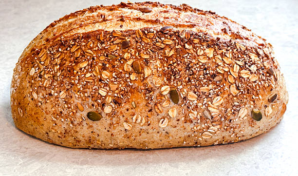 Homemade 12 grain bread that has been baked in a roast pan.