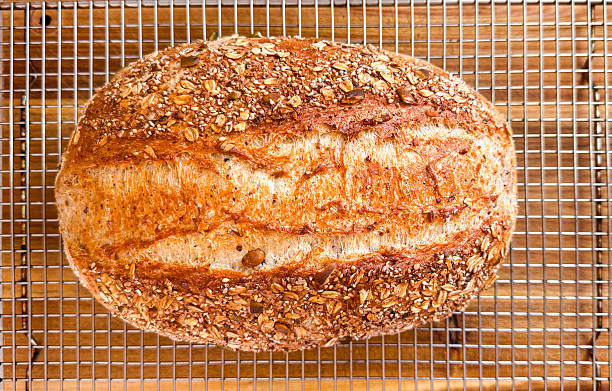 Homemade 12 grain bread that has been baked in a roast pan.