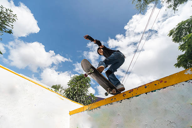 young people and children practicing skating in a skate park