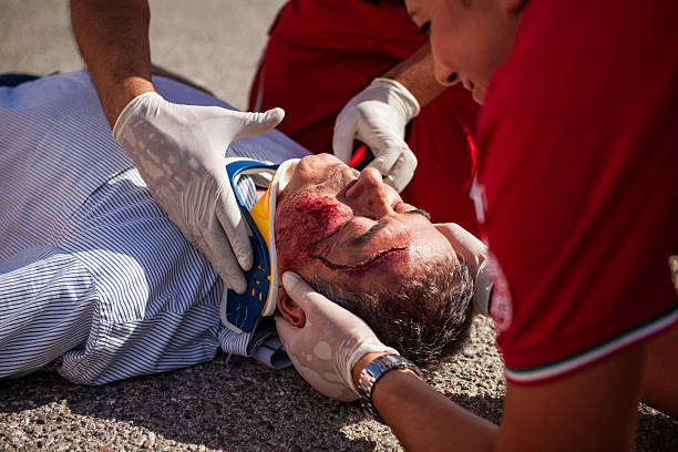 istock Paramedics Stabilizing Injured Man After Road Accident 2254791444