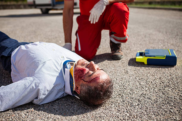 istock Paramedics Stabilizing Injured Man After Road Accident 2254791476