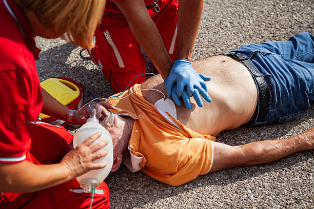 istock Paramedics Performing CPR with Defibrillator and Ventilation Mask 2254791703