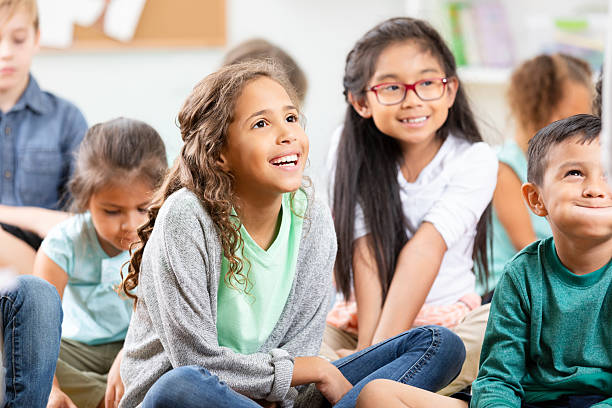 istock Diverse children engaged and attentive in a classroom learning setting, fostering teamwork and collaboration 2254793017