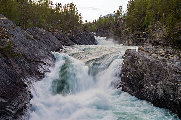 istock Powerful mountain river rapids rushing through a narrow rocky gorge. 2254793493