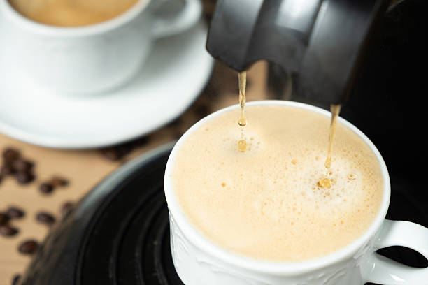 Process of making coffee using a pod machine with two streams of beverage