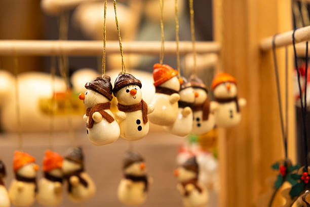 Handmade wooden snowmen figures Christmas tree decorations.