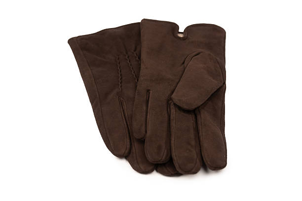 A man wearing the brown leather gloves in winter.