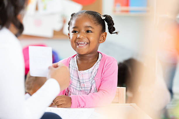 istock Happy young child smiles during an indoor lesson in a classroom setting. 2254803326