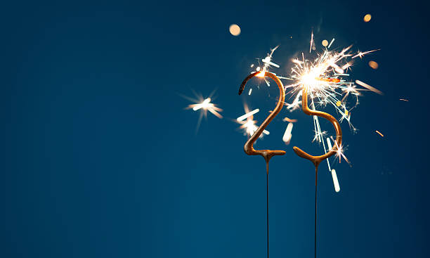 istock 25 years anniversary celebration festive background with copy space made with Bengal fires in the form of number Twenty five. 2254803580