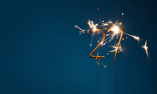 istock 27 years celebration festive background with copy space made with Bengal fires in the form of number Twenty seven. 2254803599