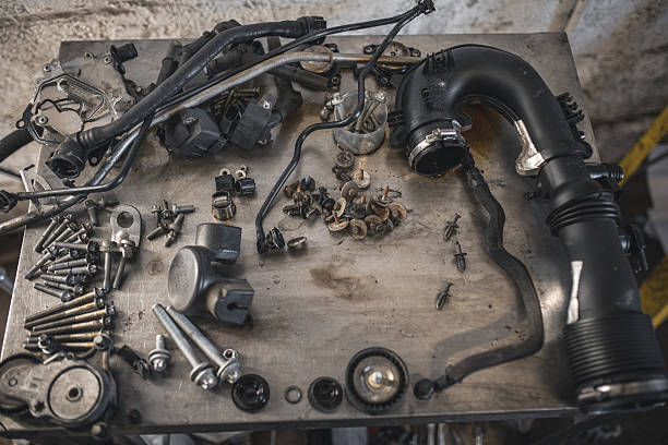 istock Disassembled car engine parts are displayed on a workbench, awaiting repair or reassembly. 2254805209