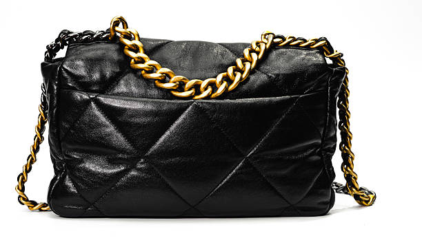 istock Luxury Black Quilted Leather Shoulder Bag with Gold Chain Isolated on White Background 2254806788