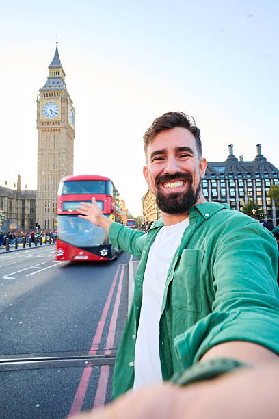 istock Smiling man taking selfie in London with big ben. 2254809349