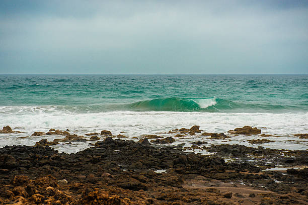Volcanic Rock Forming A Sea Coastline And A Volcanic Island