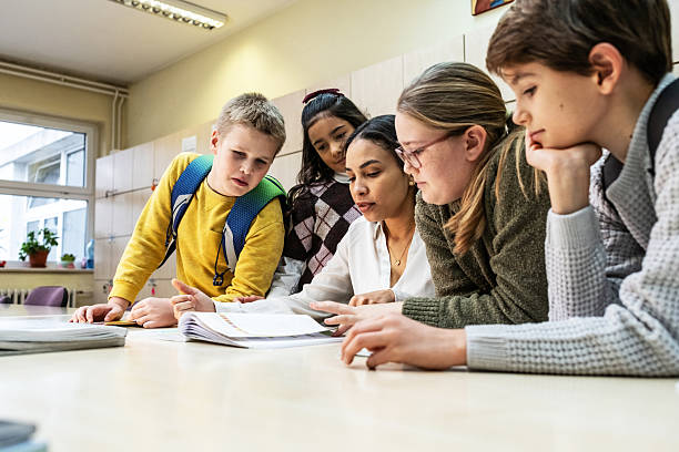istock A small group of students is in their elementary classroom while a mixed-race teacher guides them through a math and geometry lesson. 2254810249