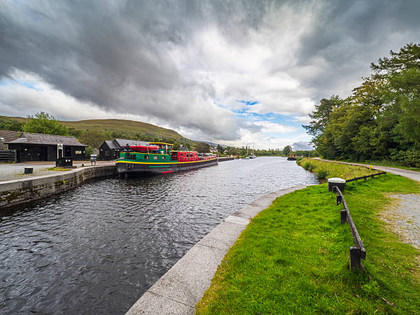 istock Colorful barge navigating Caledonian Canal lock in Fort William 2254810793