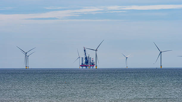 istock Offshore wind farm installation connecting with renewable power 2254811852