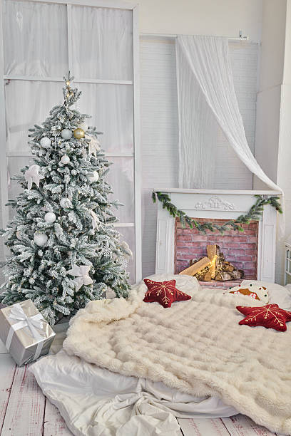 istock Cozy holiday scene with Christmas tree and fireplace 2254812152