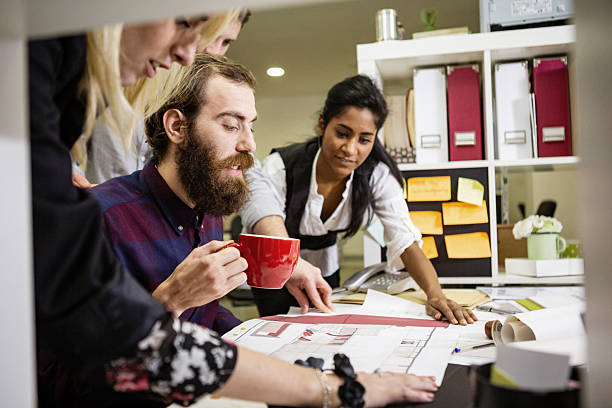 istock Creative Coworkers Collaborating on Design Project in Office 2254815545