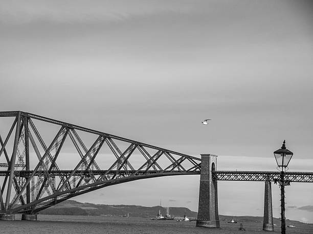 The Forth Bridge is a cantilever railway bridge across the Firth of Forth in the east of Scotland, west of Edinburgh. It is an iconic symbol of Scotland and is a UNESCO World Heritage Site. The imposing structure, which combines strength with beauty, dominates the landscape. Photo taken at North Queensferry.