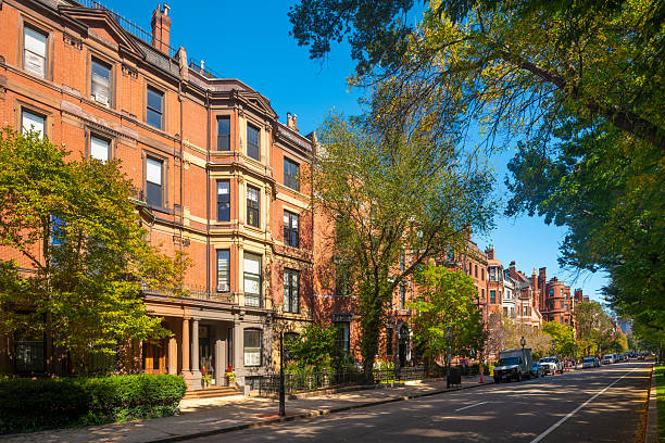Boston, Massachusetts, United States - October 06, 2025: The elegant residential architecture of Back Bay Boston along the tree lined Commonwealth Avenue Mall in summer.