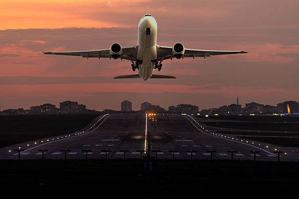 istock Passenger airplane landing at dusk 2254821807