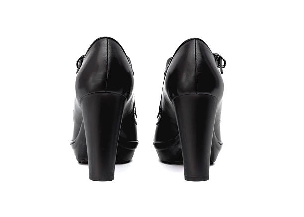 Elegant black Mary Jane style high heel shoes with thick platform sole and rounded toe design photographed in studio on a clean white background featuring glossy leather texture adjustable strap and chunky heel suitable for fashion retail catalog vintage inspired footwear concepts and luxury womens style without people and with copy space