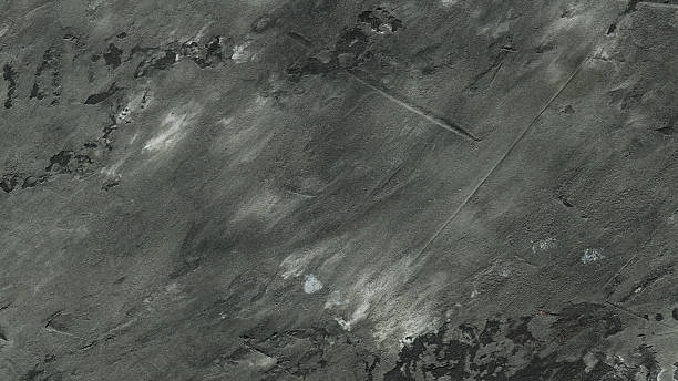 Grey Concrete Surface Texture with Natural Cracks and Weathered Pattern Close-Up Background