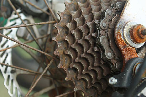 bicycle transmission components showing gears (sprockets) and chains that are corroded or rusty due to lack of maintenance