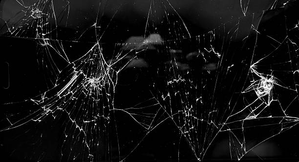 istock cracked glass isolated in black background 2254826961