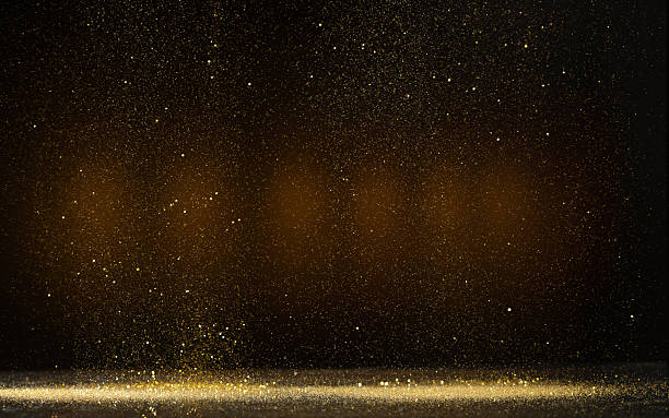 istock Golden Dust Sparkles Background with Glowing Light Particles Floating in Dark Air. Elegant Luxury Abstract Texture for Celebration, Christmas, and Glamorous Design Concepts, Photo 2254829712