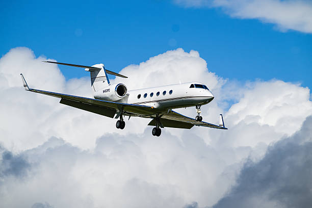 Everett, WA, USA - May 19, 2025; Gulfstream aerospace GIV-X G450 on final approach with clouds
