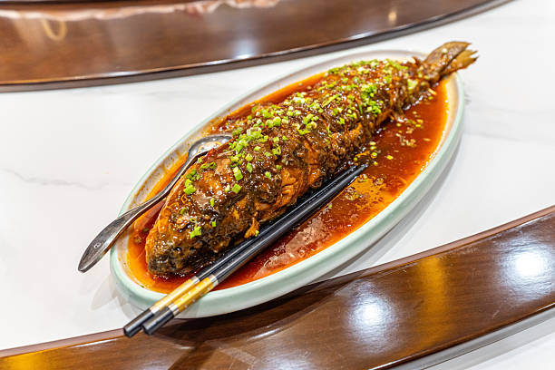 Vietnamese Fish Simmered in Caramel Sauce Ca Kho To on white background