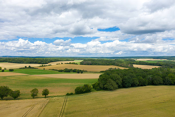 istock Rolling farmland with green and golden fields 2254835518