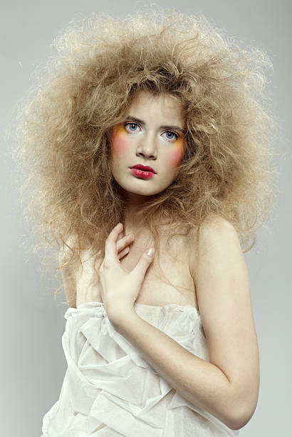 istock girl with shock hair-do 2254836852
