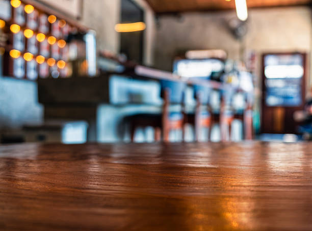 Table top wooden counter Cafe restaurant Bar interior Blur background