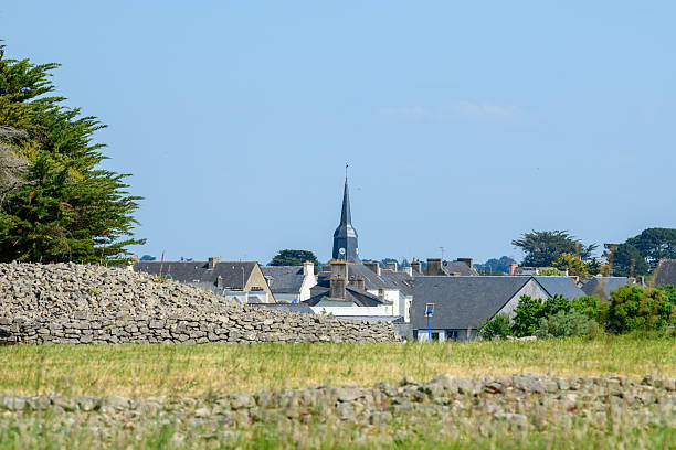 istock Stone wall and village skyline, Locmariaquer 2254843158