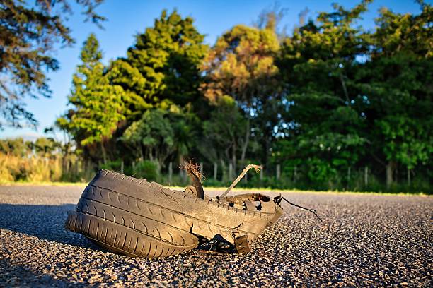 What is left after a car tire has been blown out., eft on a roadway.