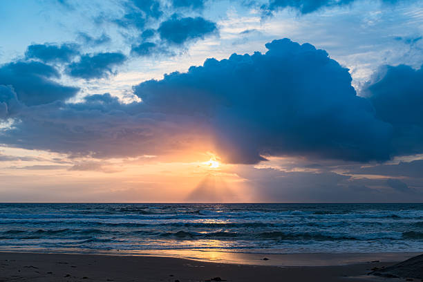 Watching the dance of clouds at the beach\