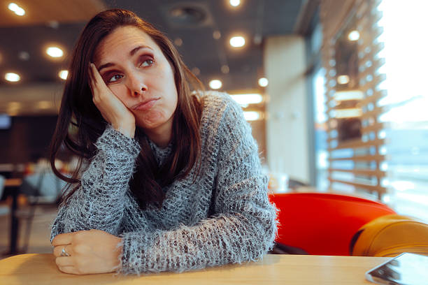istock Sad Upset Girlfriend Waiting for her Date in a Restaurant 2254849466