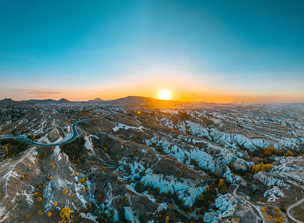 istock Cappadocia (Kapadokya)’s sunset landscape, captured in a panoramic drone view, highlights the region’s fairy-tale texture and its natural rock formations in a striking way. 2254850218