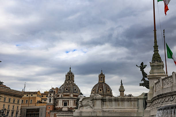 A beautiful Baroque-style dome can be seen in the distance from the square.