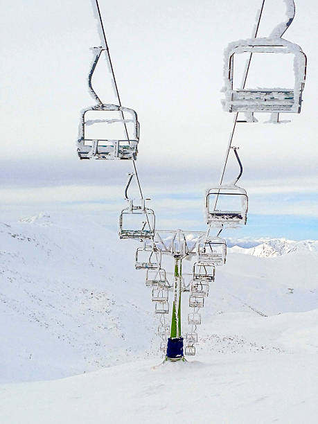 Fresh snowfall covers Tochal Peak in northern Tehran, Iran. Snowy mountain ridges and winter clouds create a dramatic alpine landscape overlooking the Iranian capital during the cold season.