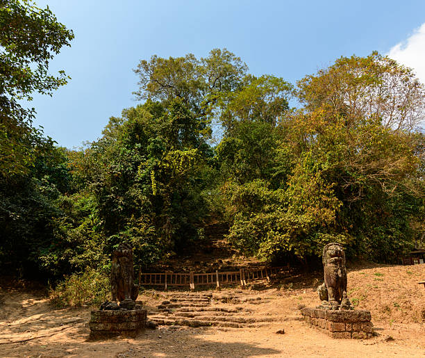 istock Stone lion statues at Phnom Bakheng forest entrance 2254859285